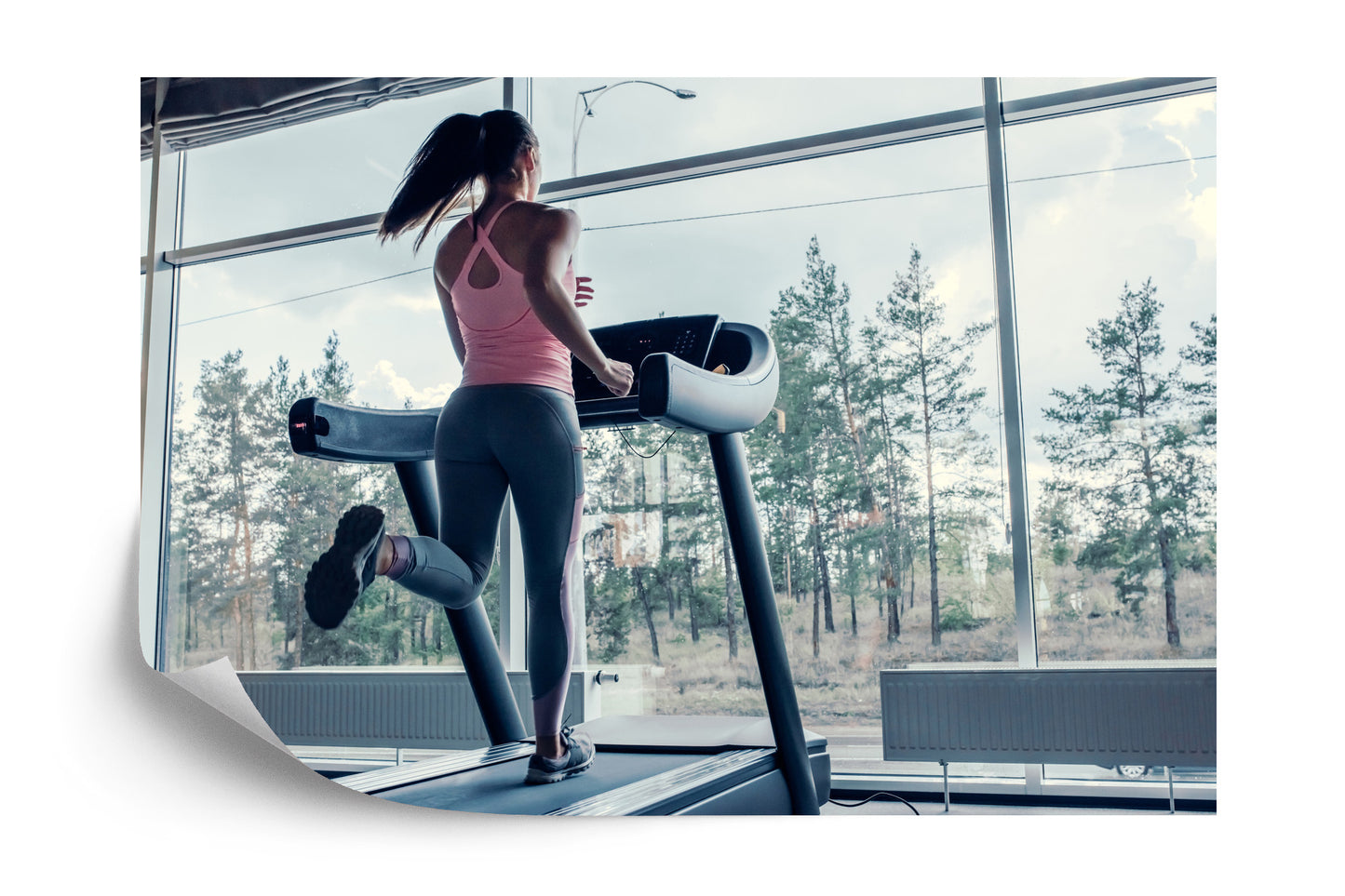 Photomural Woman On A Treadmill With The Landscape Outside The Window